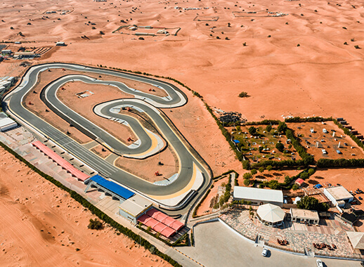 Aerial view of Monster Experience facilities with go kart track and Dune buggy safari in Dubai desert