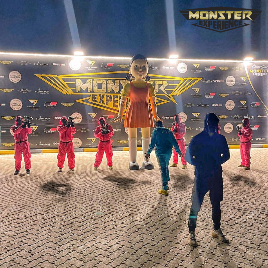 Group of people dressed as money heist characters preparing to play paintball at Monster Experience in Dubai