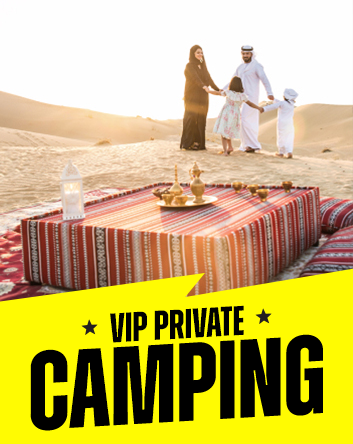 Arabic family around a camping table in the Dubai Desert at sunset