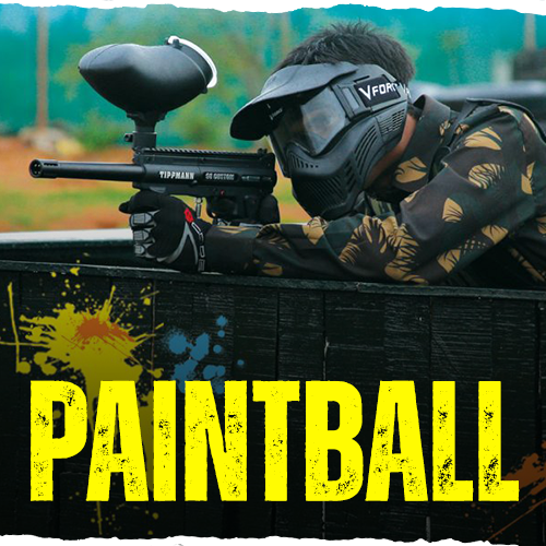 Man playing paintball and holding paintball gun at the Monster Experience paintball course in Dubai