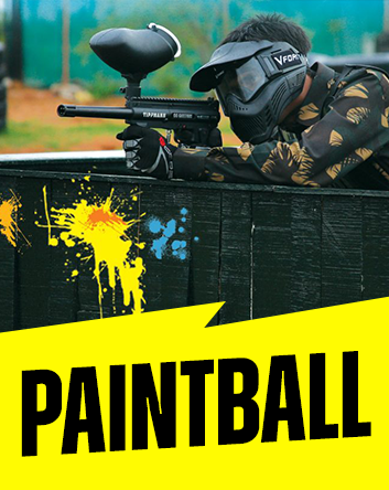 Man playing paintball and holding paintball gun at the Monster Experience paintball course in Dubai