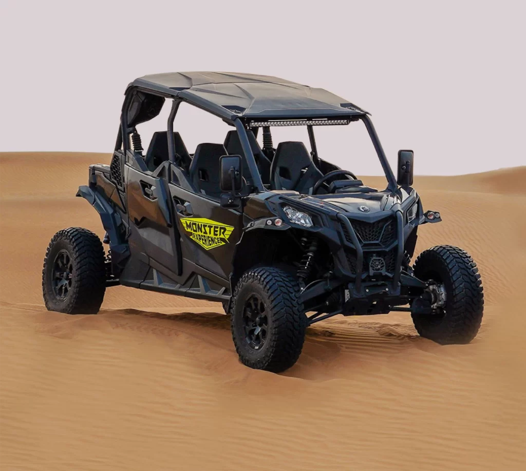 black color 4 seater buggy in desert. can am maverick sport 4 seater black buggy on desert dune