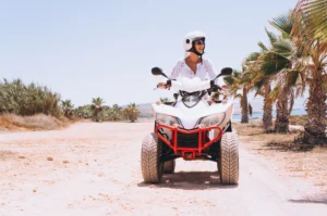 woman-travelling-quad-by-th-ocean-1-min-scaled.
